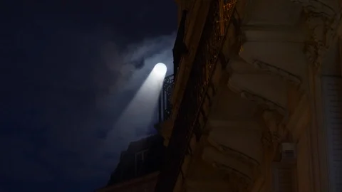 Beam of light coming from the full moon over Parisian building Stock Footage 105814665