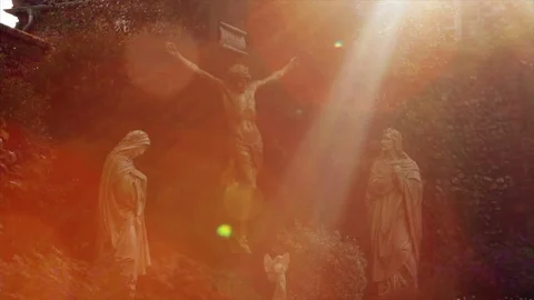 Beam of light illuminates statues of Jesus, Mary and Joseph 動画素材 76427572