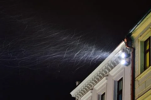 A beam of light from a lamp mounted under the roof illuminates the whirling s Stock Photos