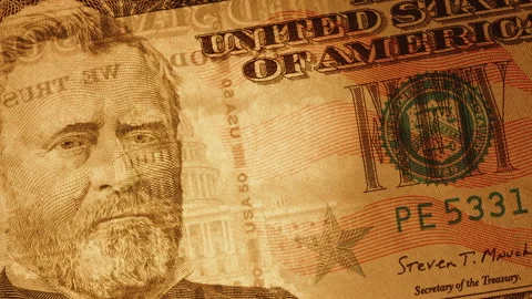 A Beam Of Light Shines Through A Fifty-Dollar Bill Showing Watermarks Inside. Stock Footage 277616778