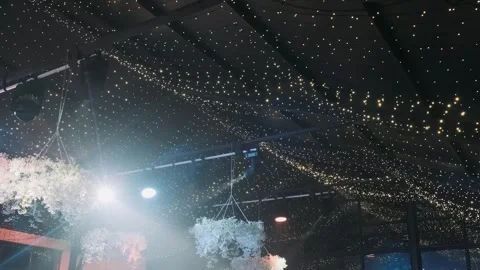 A beam of light from a spotlight illuminates a decorated banquet hall Video stock 270891901