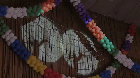 In the beam of light on the wall the shadow of the silhouettes of aerialists Stock Footage 98863897