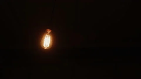 Beaming Lightbulb In Dark Room Stock Footage 208789563