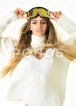 Beaming woman. Winter time fun. Girl in ski or snowboard wear. Ski resort and Stock Photos