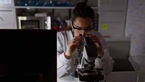 A beaming young hispanic scientist, a vision of beauty, lost in the world o.. Stock Footage 268568600