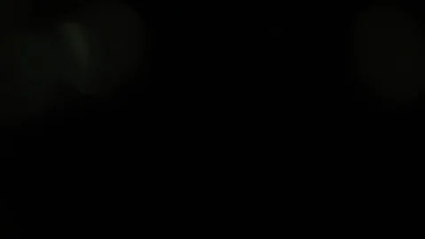 Beams, bokeh, light, glare on a dark background Stock Footage 129166120