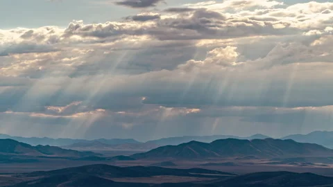 Beams of light shining through the clouds moving through the sky Video stock 158136442