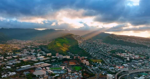 Beams of setting sun go through the huge cloudscape covering the sky Video stock 312348876