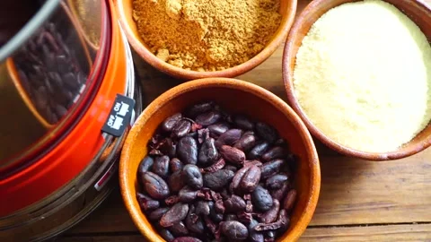 Bean to bar milk chocolate making at home with chocolate refiner Stock Footage 242540448