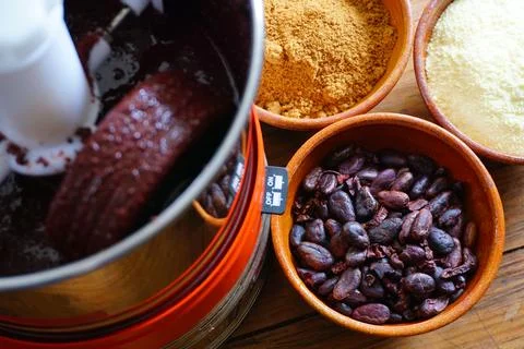 Bean to bar milk chocolate making at home with chocolate refiner Stock Photos