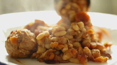 Bean with meat balls poured into plate Stock Footage 40369983