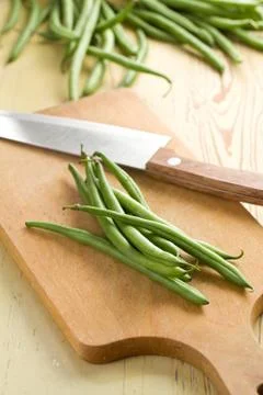 Bean pods with knife Stock Photos
