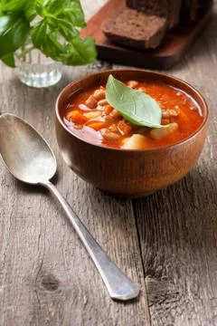 Bean soup and basil Stock Photos