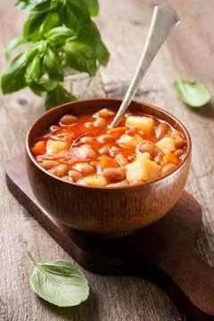 Bean soup and basil Stock Photos