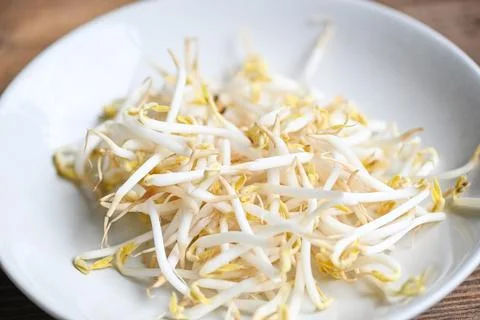 Bean sprouts on white plate table background in the kitchen, Raw white orga.. Stock Photos
