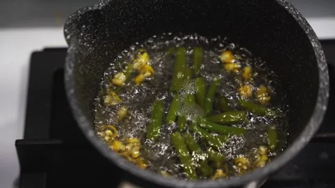 Beans and corn cooked in a saucepan on the stovetop Stock Footage 305224094