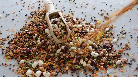 Beans and lentils pouring on table Stock Footage 135676741