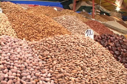 Beans and other foods fill a stall at a market in Marrakesh Morocco. Stock Footage