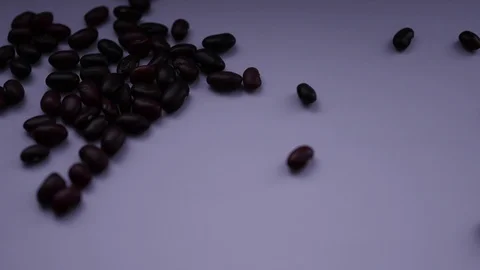Beans are falling on a grey background Stock Footage 88771323