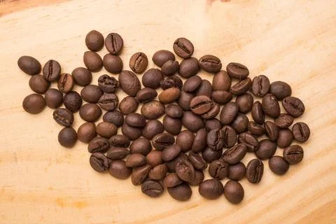 Beans of Coffee Beans of coffee on a light wooden table Copyright: xZoonar... Stock-Fotos