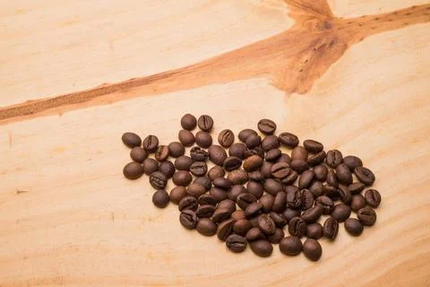 Beans of Coffee Beans of coffee on a light wooden table Copyright: xZoonar... Stock-Fotos