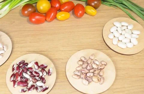 Beans of different varieties on the table Stock Photos