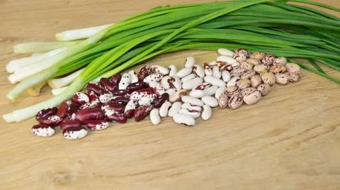 Beans of different varieties on the table Stock Photos