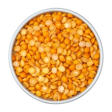Beans of dry yellow split peas Eidaho in white bowl isolated on white backgro Stock Photos