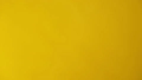 Beans Falling Slow Motion Yellow BG 4k Stock Footage 134584250