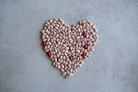 Beans shaped as heart, concept for vegetable love. Love for vegan/vegaterian  Stock Photos