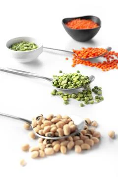 Beans on a spoon on a white background. A set of superfood cereals. Healthy Stock Photos