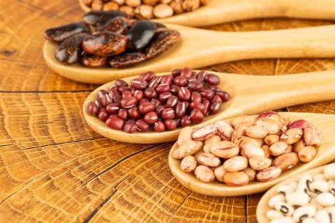 Beans in the spoons Stock Photos