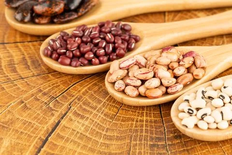 Beans in the spoons Stock Photos