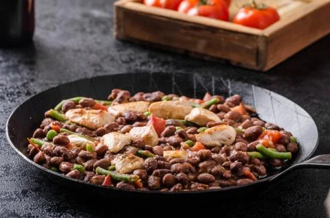 Beans with tomatoes and chicken Stock Photos
