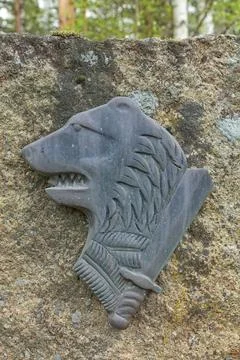 Bear and sword relief. Fotos Stock