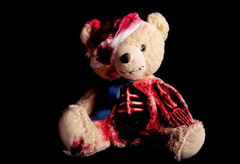 Bear on a black background with a broken head. with a bandaged eye. a skeleta Stock Photos
