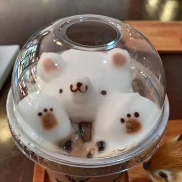 Bear shape of milk foam. Stock Photos