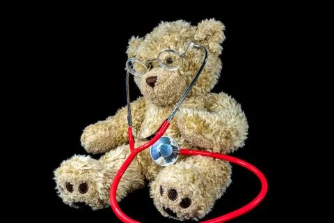 Bear with stethoscope on black Stock Photos