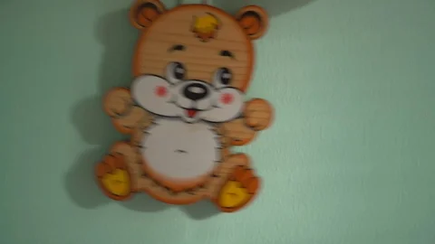 Bear toy wall clock with moving eyes Video stock 89580504