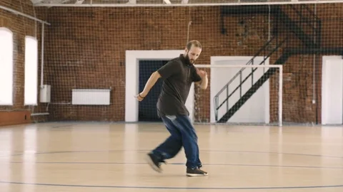 Beard breakdancer dancing in sport gym Stock Footage 79103906
