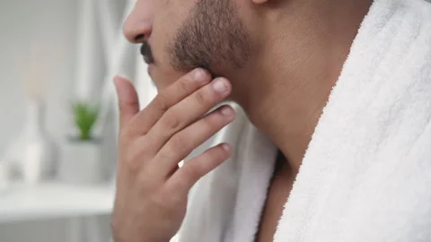 Beard care man applying shea butter face stubble Stock Footage 201664570