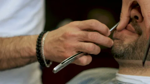 Beard cut with straight razor shave. Male beard style Stock Footage 102205033