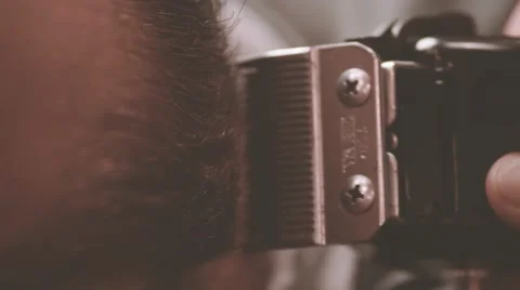 Beard cutting with clipper HD slow motion close-up video. Electric trimmer razor Stock Footage 68378498