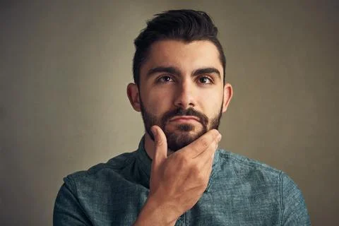 Beard, man and thinking in studio for hair care, date preparation and daily Stock Photos