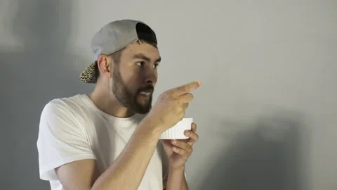 Beard man tasting strawberry ice cream and show thumbs up. Place for your text. Stock Footage 159929018
