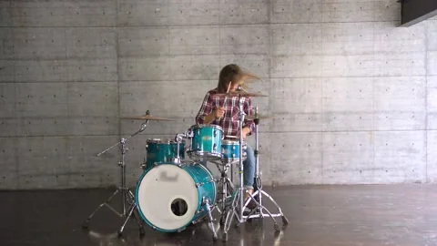 Beard Stylish Guy entering the frame and siting down to play the drums. Stock Footage 155553787