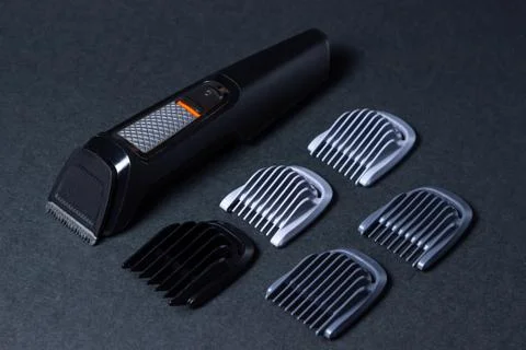 Beard trimmer on a black background.  Stock Photos