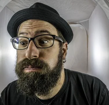 A bearded and disappointed man with empty eyes Stock Photos