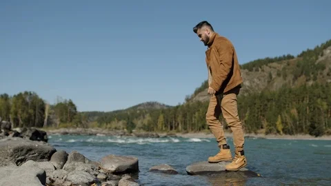 Bearded attractive hipster hiker young tourist traveler man traveling jumping Stock Footage 121515744