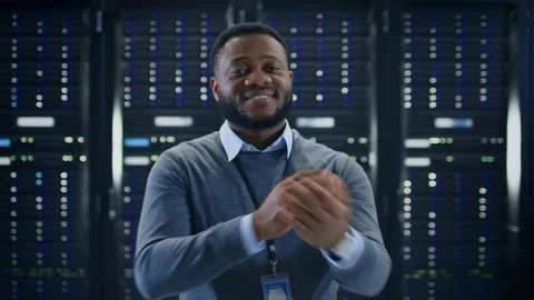 Bearded Black IT Engineer Standing and Posing with Crossed Arms in the Middle Stock Footage 100813648